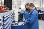 Treston's heavy drawer unit and two workers taking some pieces from it